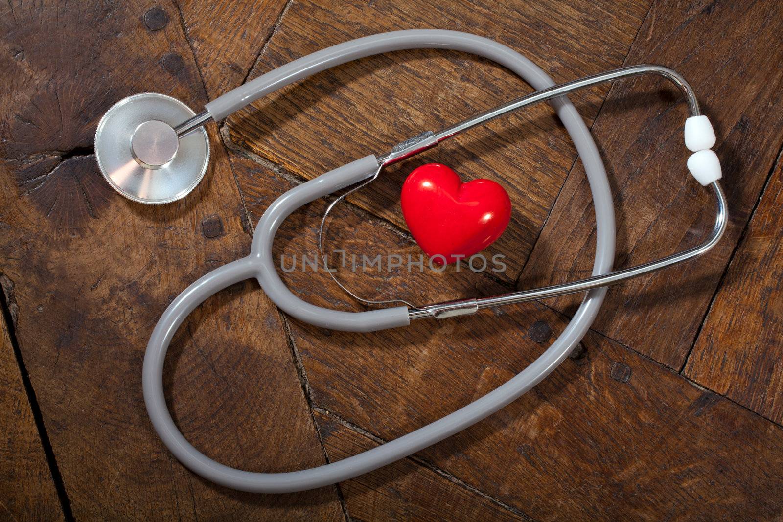 Stethoscope & heart by Portokalis