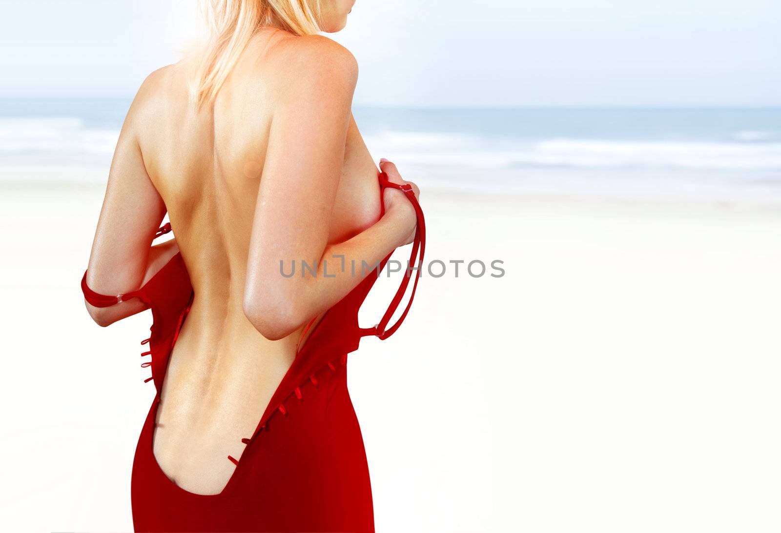 back of woman on shore l by ssuaphoto