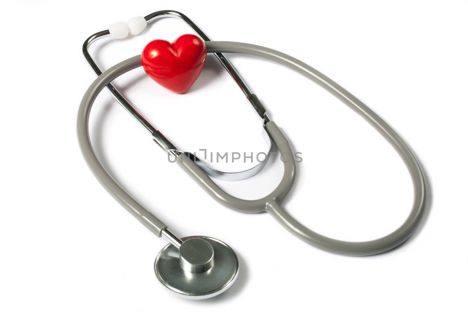 Stethoscope & red heart on white background