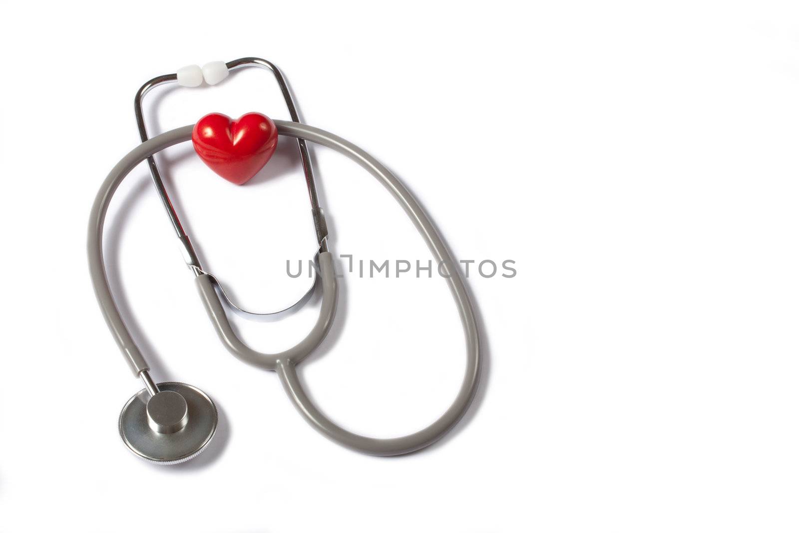 Stethoscope & red heart by Portokalis