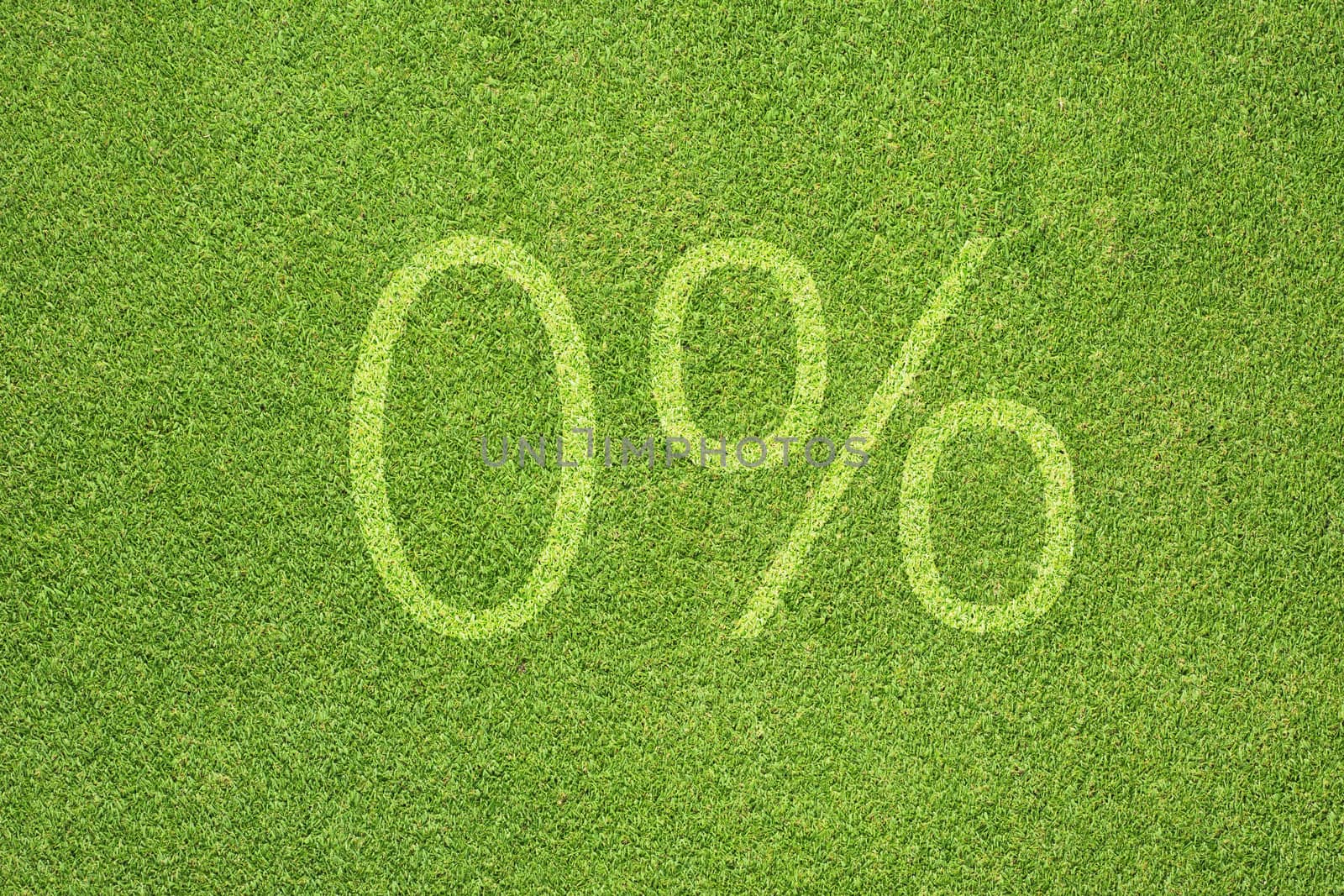 Percent icon on green grass texture and background 