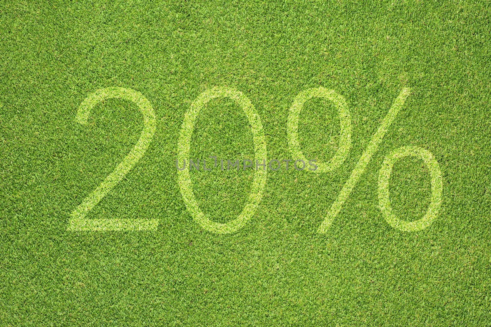 Percent icon on green grass texture and background  by jumpe