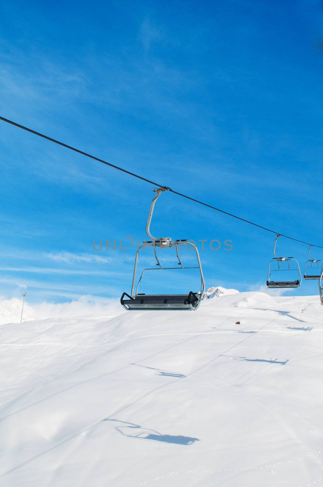 Skilift on bright winter day by Elnur