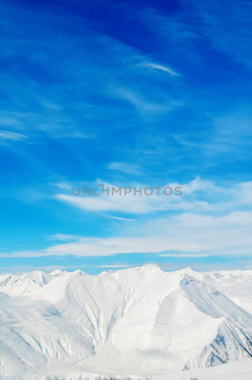 Snow mountains on bright winter day