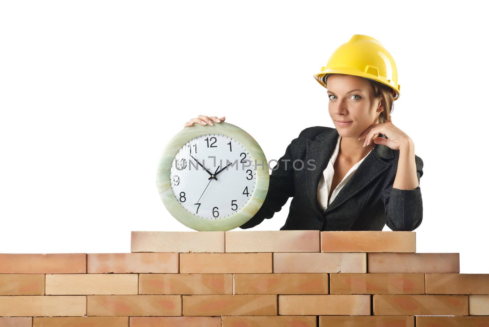 Female builder and clock on white