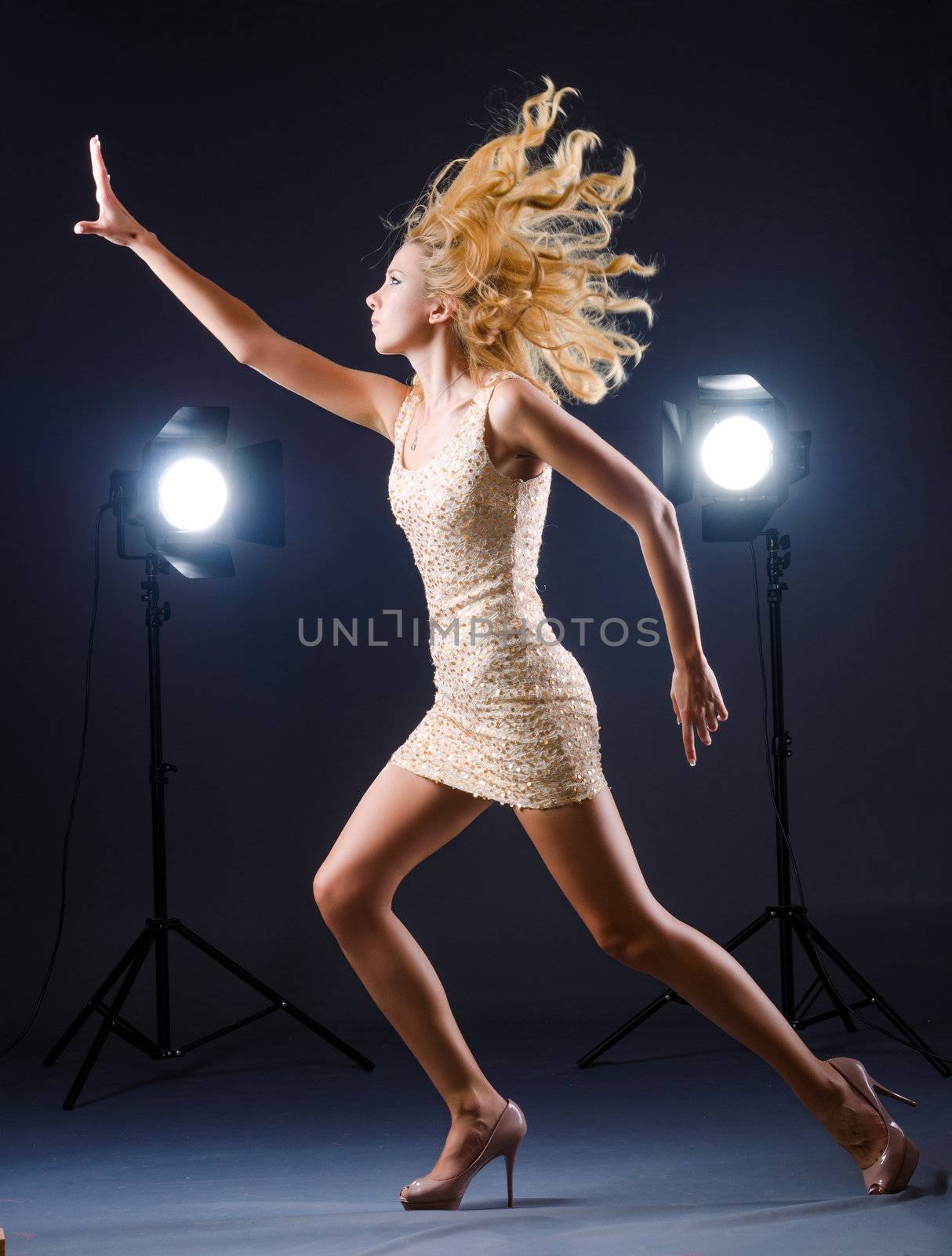 Young attractive woman in photo studio