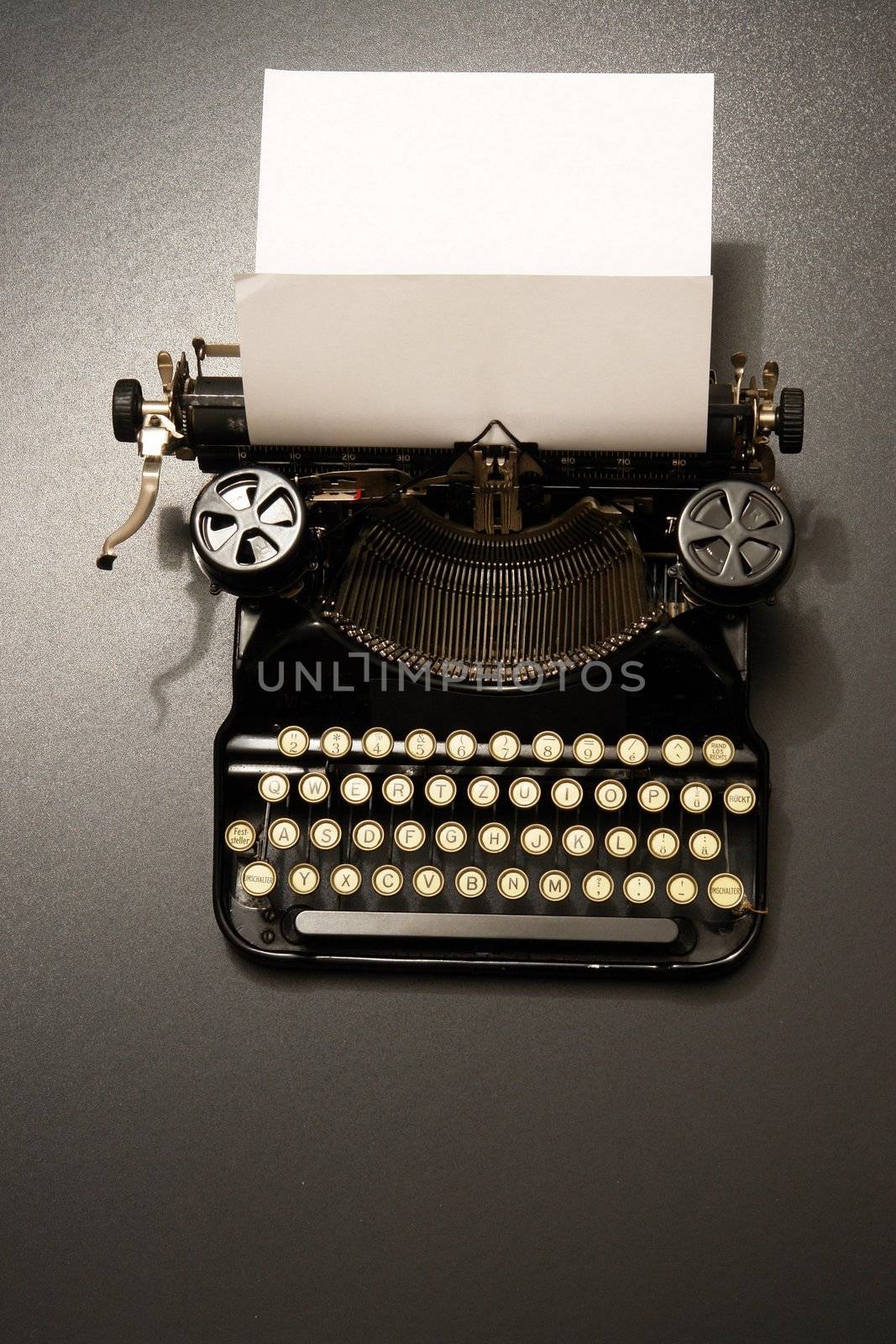 a typewriter in dramatic lighting.