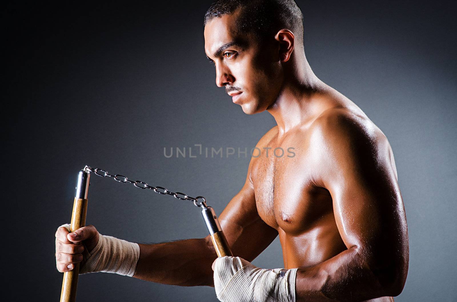 Strong man with nunchaku