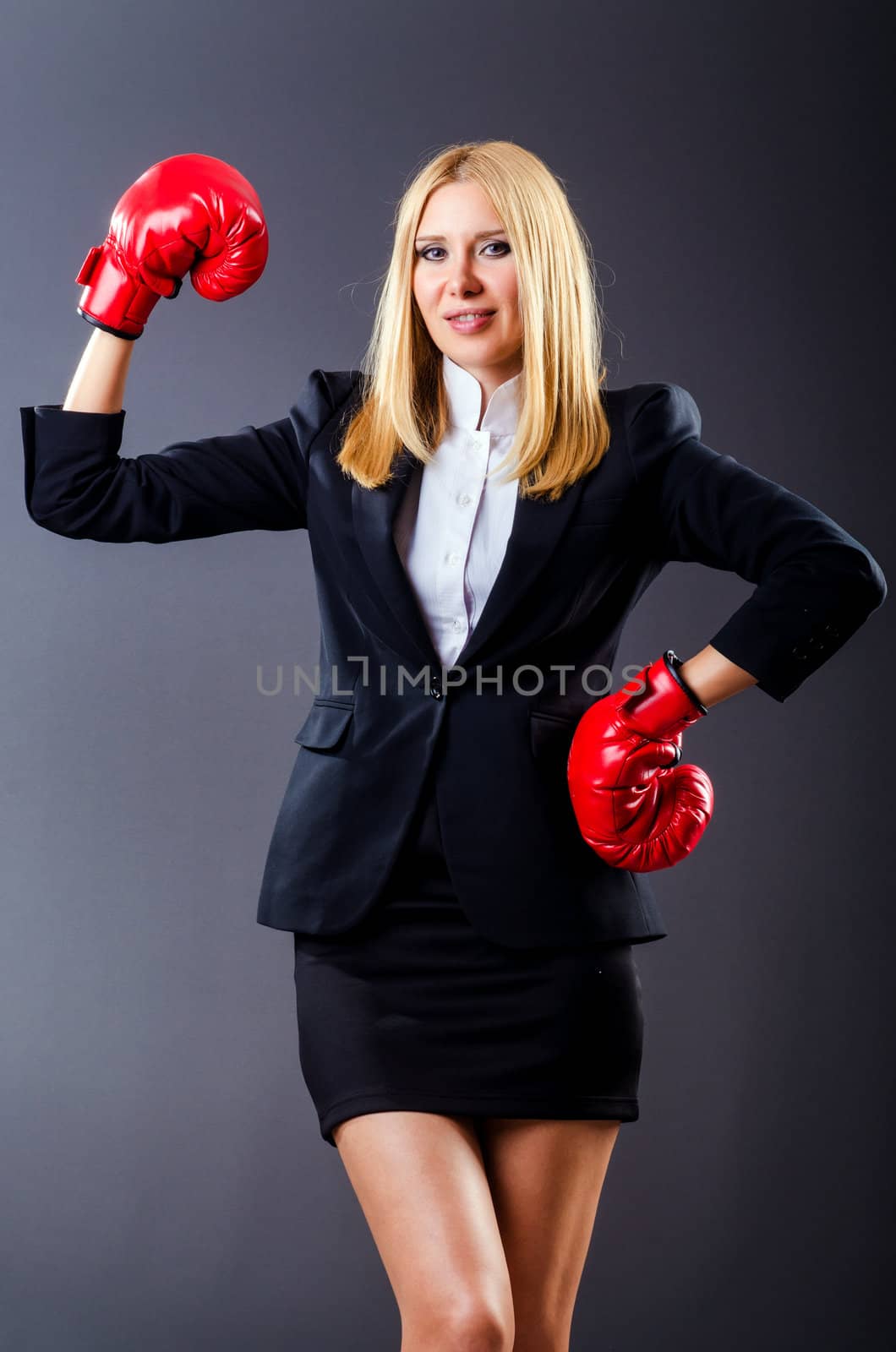 Woman boxer in dark room