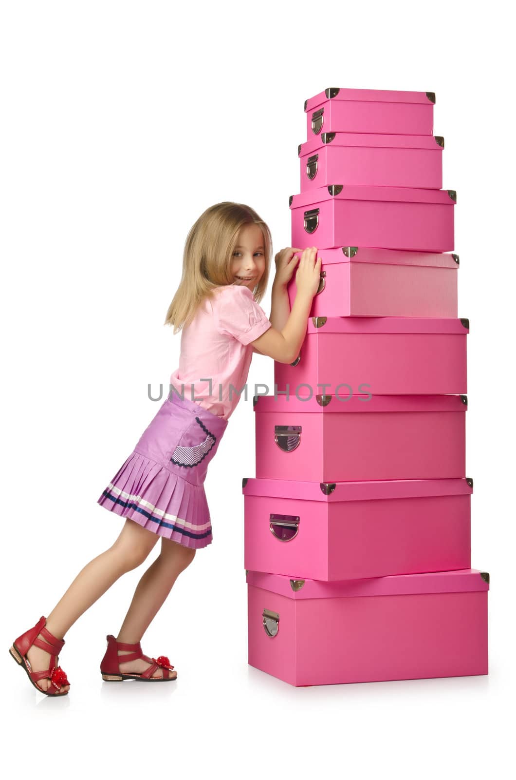 Little cute girl with lots of boxes