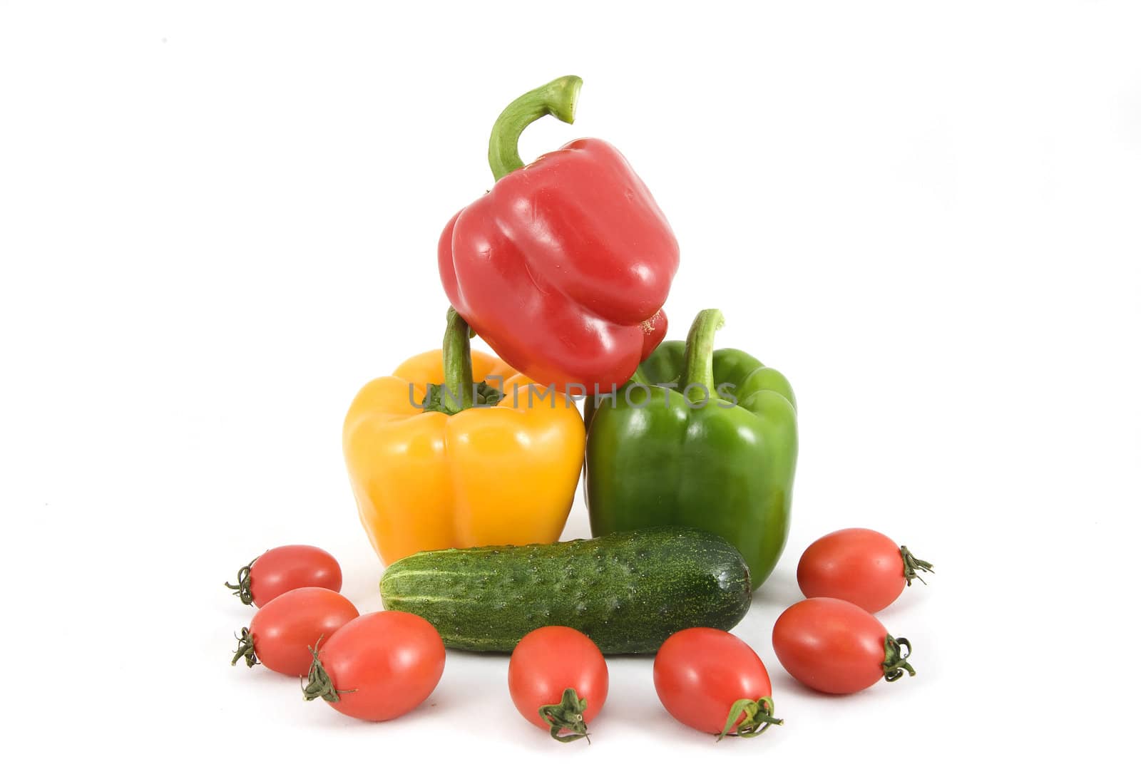 sweet peppers, tomatoes and cucumbers on a white background