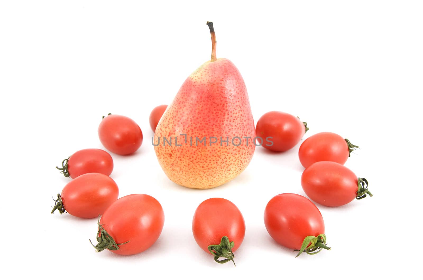 red ripe tomatoes and pear on a white background