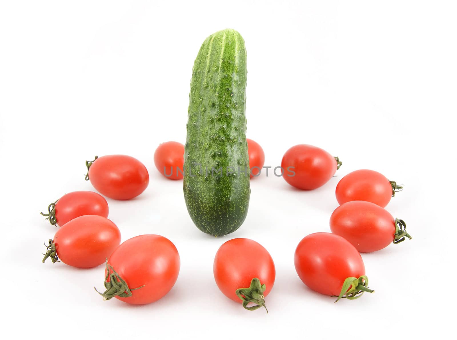 red ripe tomatoes and cucumbers on a white background