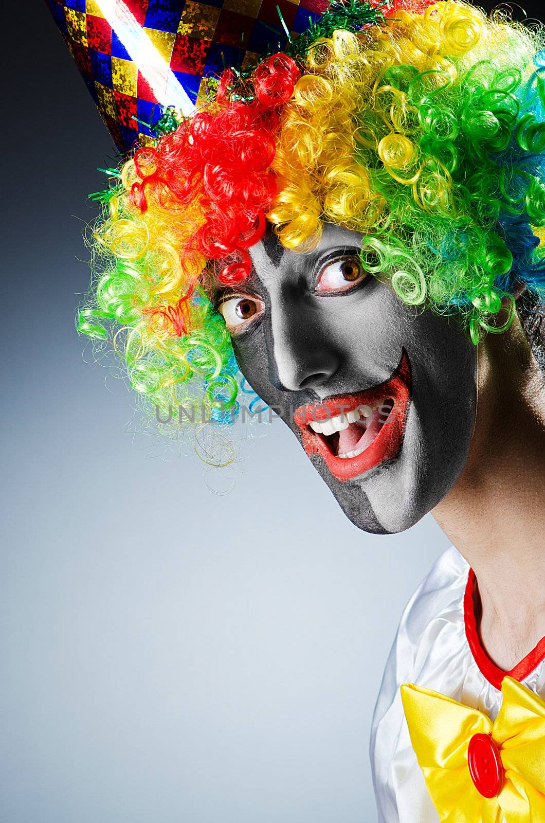 Funny clown in studio shooting