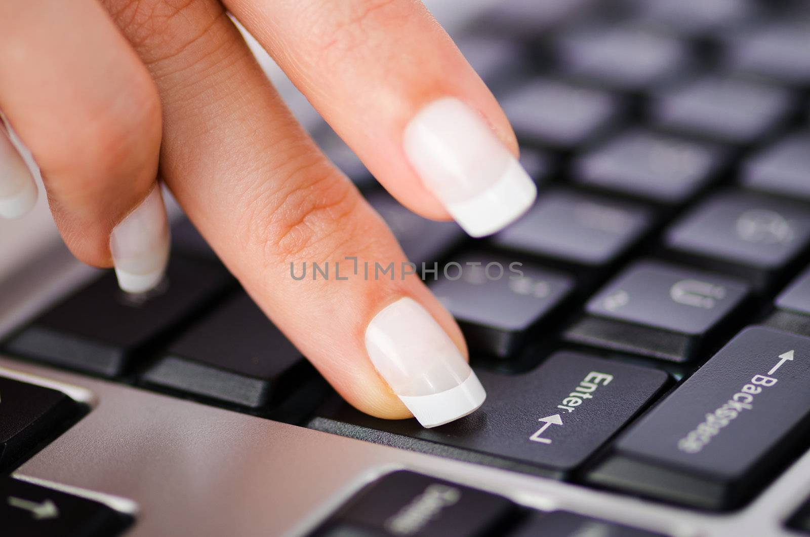 Hands working on the keyboard