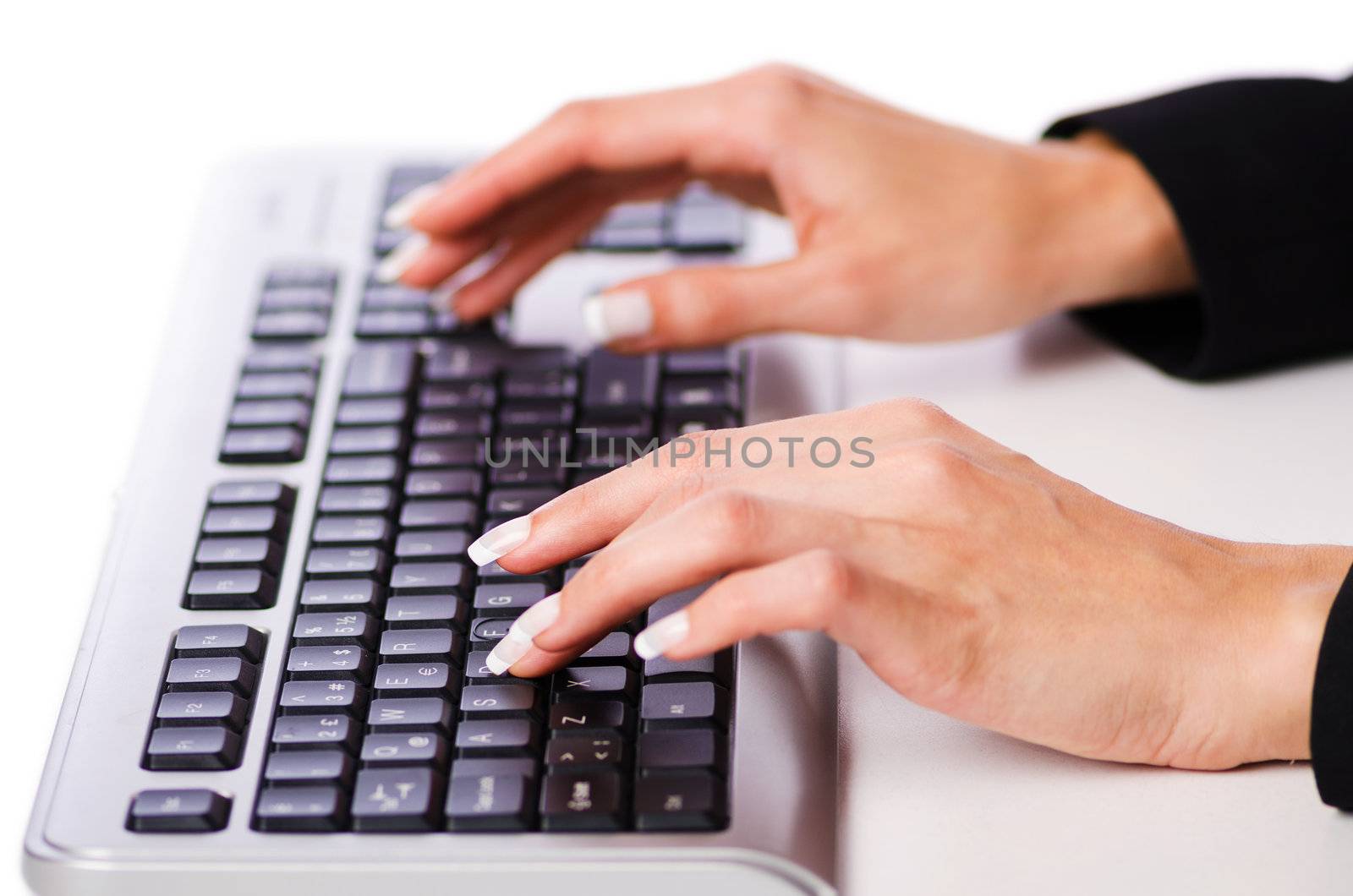 Hands working on the keyboard