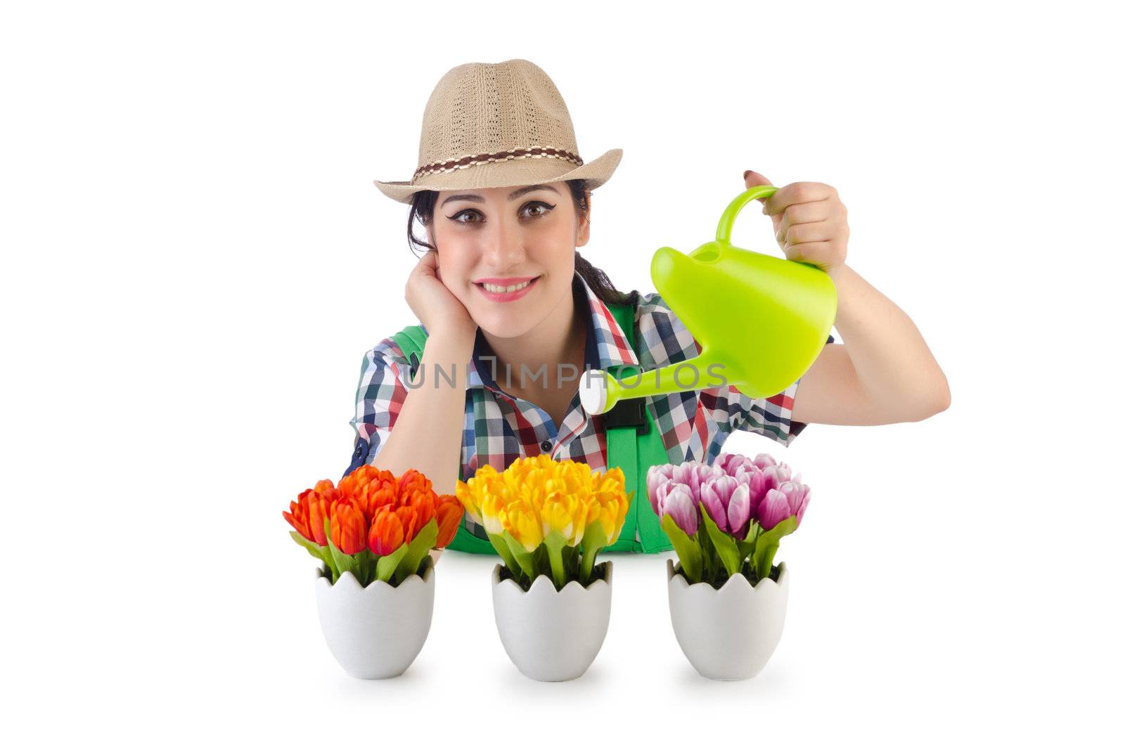 Girl watering plants on white