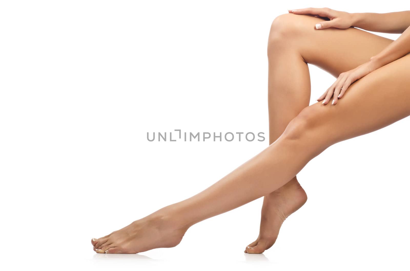 Long woman legs isolated on white