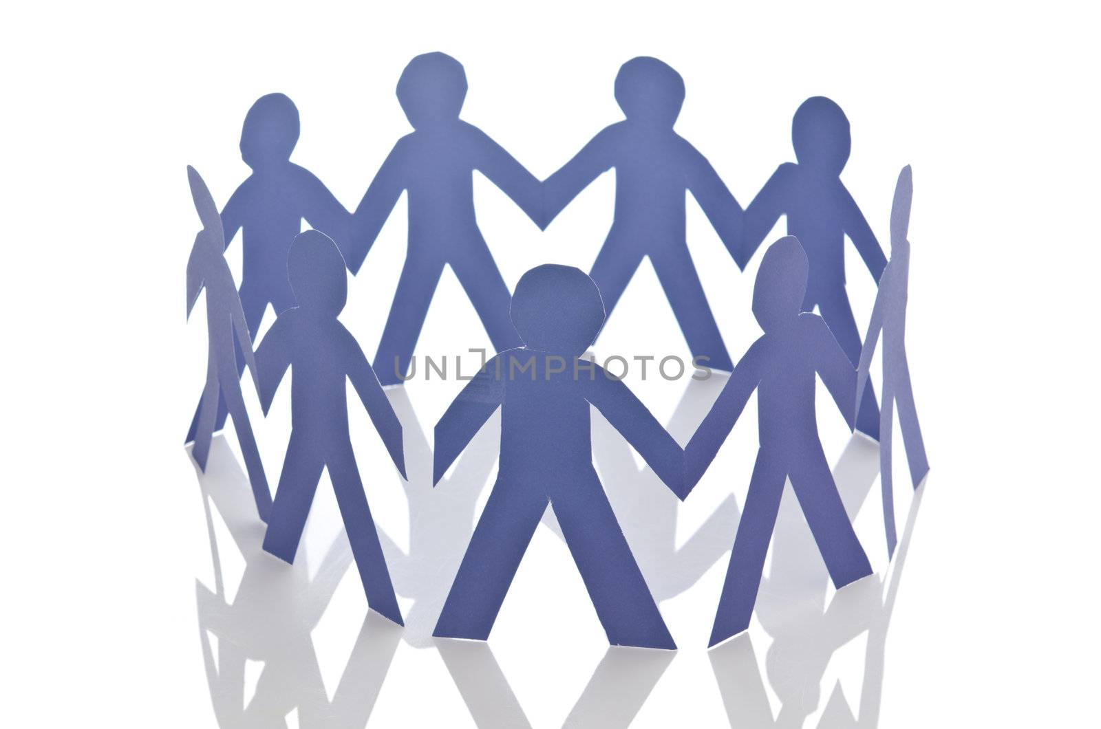 Teamwork concept with paper cut people by Elnur