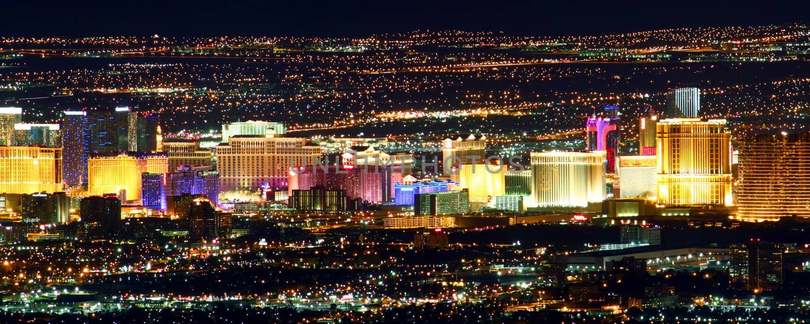 Las Vegas, USA - November 26, 2011: Bright lights of hotels and casinos of the Las Vegas Strip. The Strip is about 4 miles long and is seen here from the Frenchman Mountain summit.