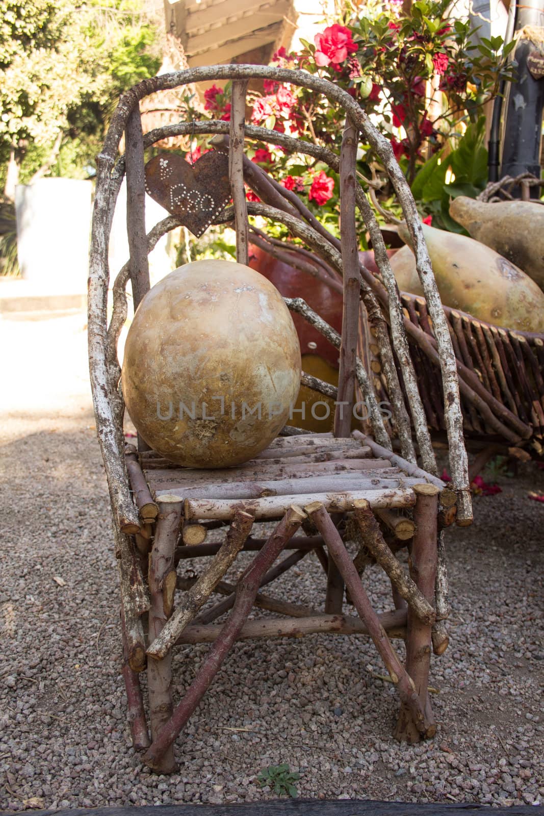 Antique handmade furniture made out of wood setup in a natural setting outdoors