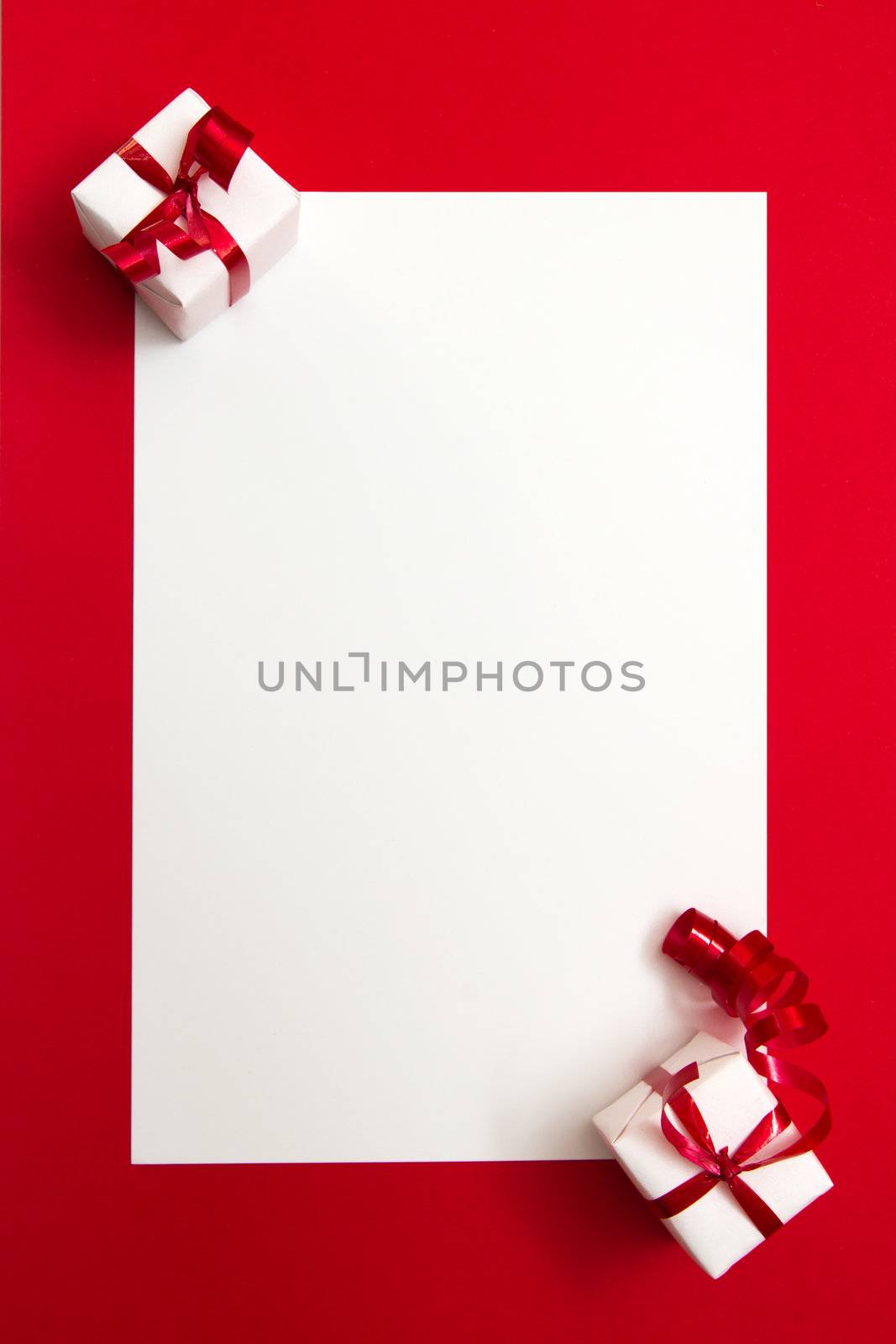 Two wrapped gifts represent christmas theme, with a blank white card for text