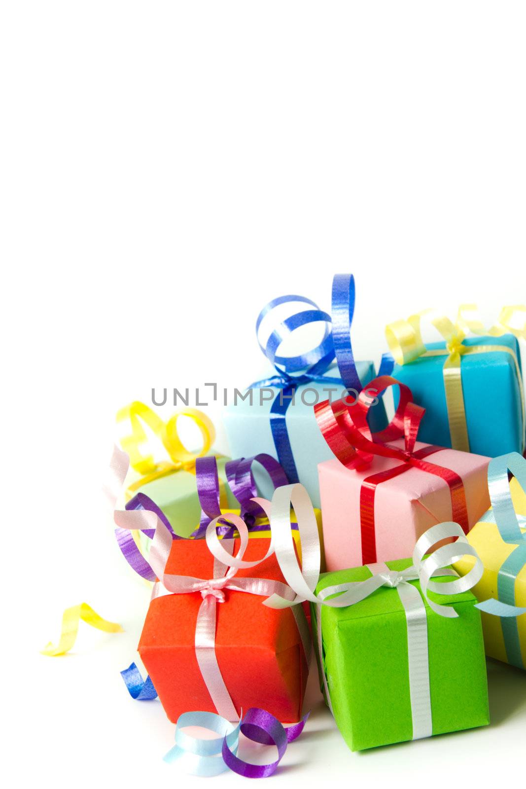 Multi color gift boxes with ribbon isolated on white background