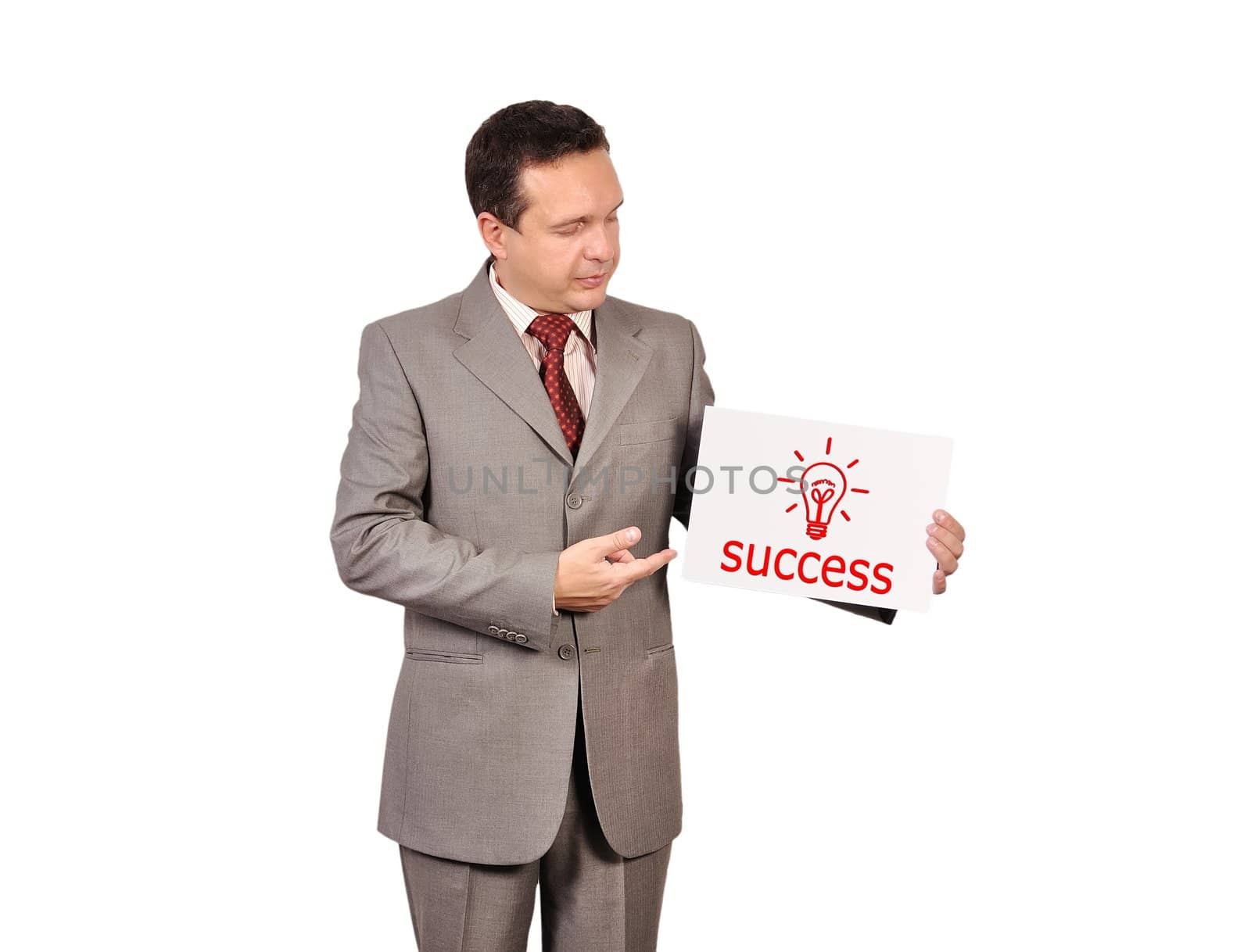 businessman holding a placard with success concept