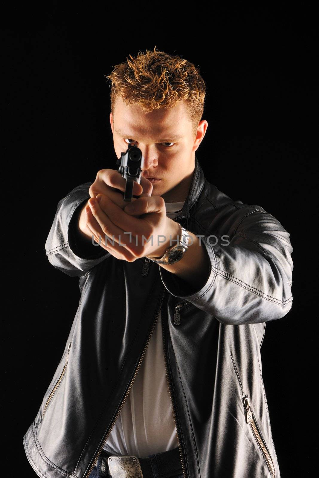 Man holding gun with over black