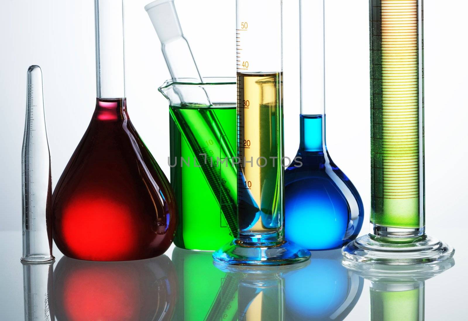 Chemical flasks with reagents isolated on white background