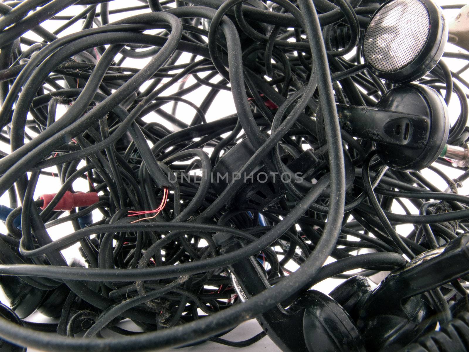 Interlacing of the broken off wires of old headphones. background