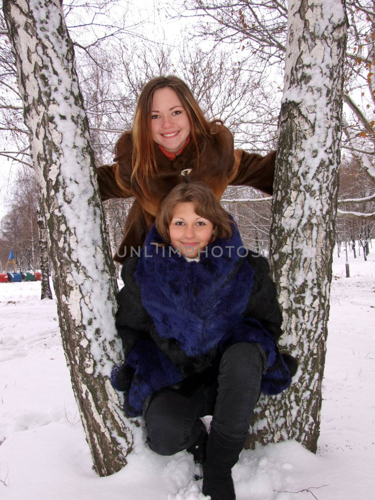 Two girls in the winter in park