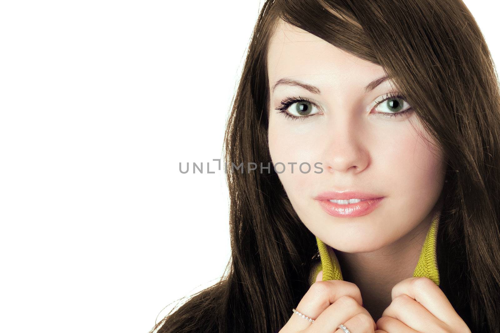 Close-up of pretty young attractive brunette. Isolated on white