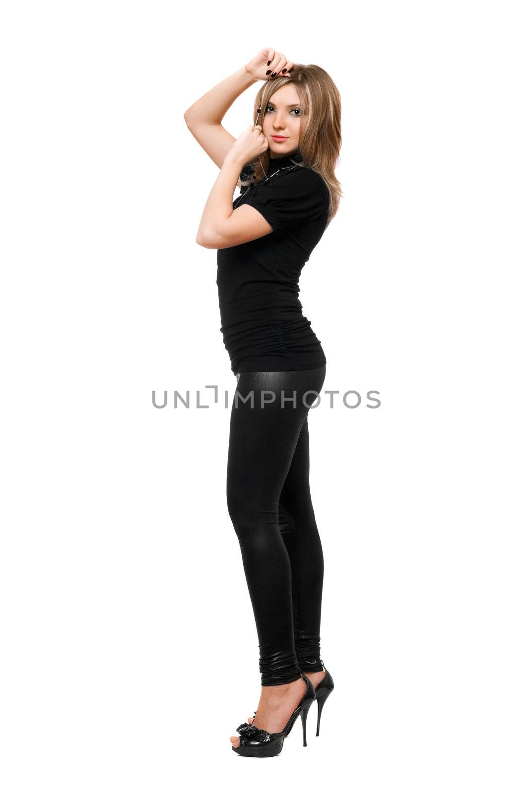 Attractive young woman in leggings. Isolated on white background