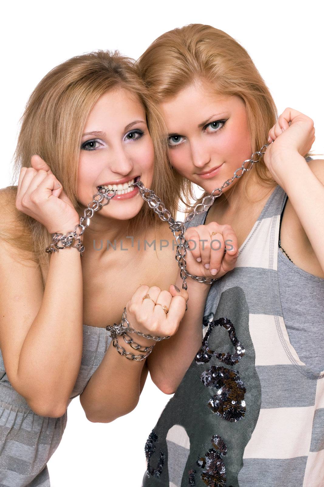 Two playful young women bound a chain by acidgrey