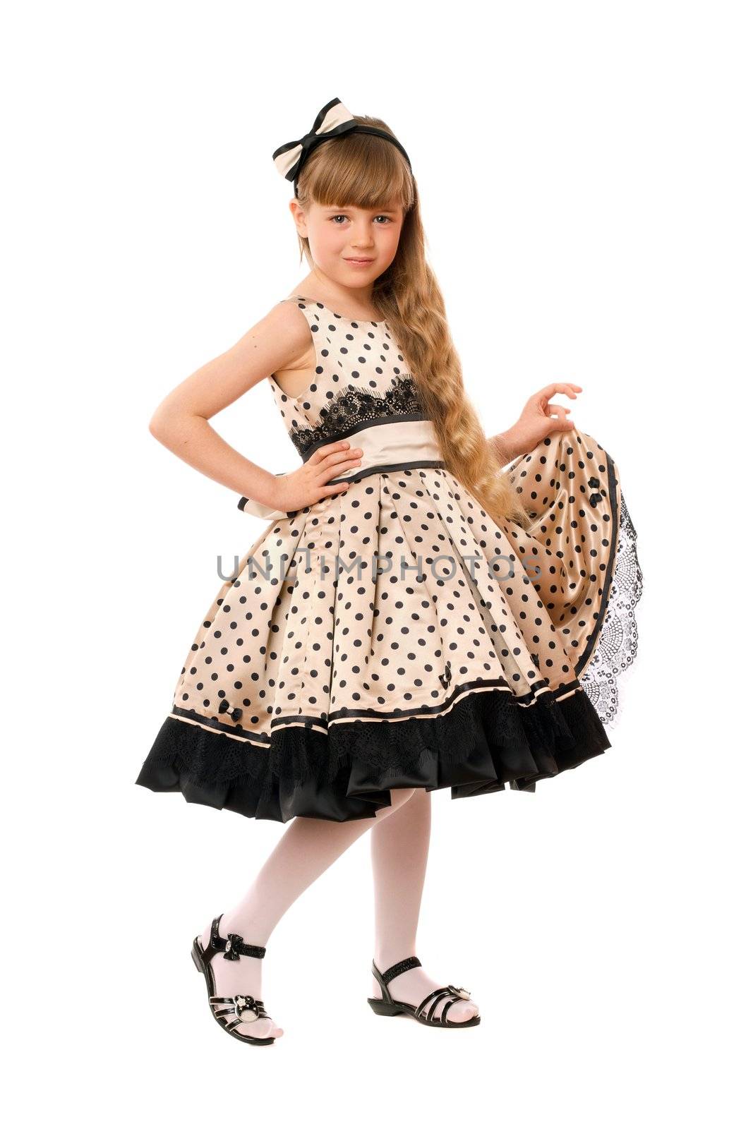 Lovely little girl in a dress. Isolated