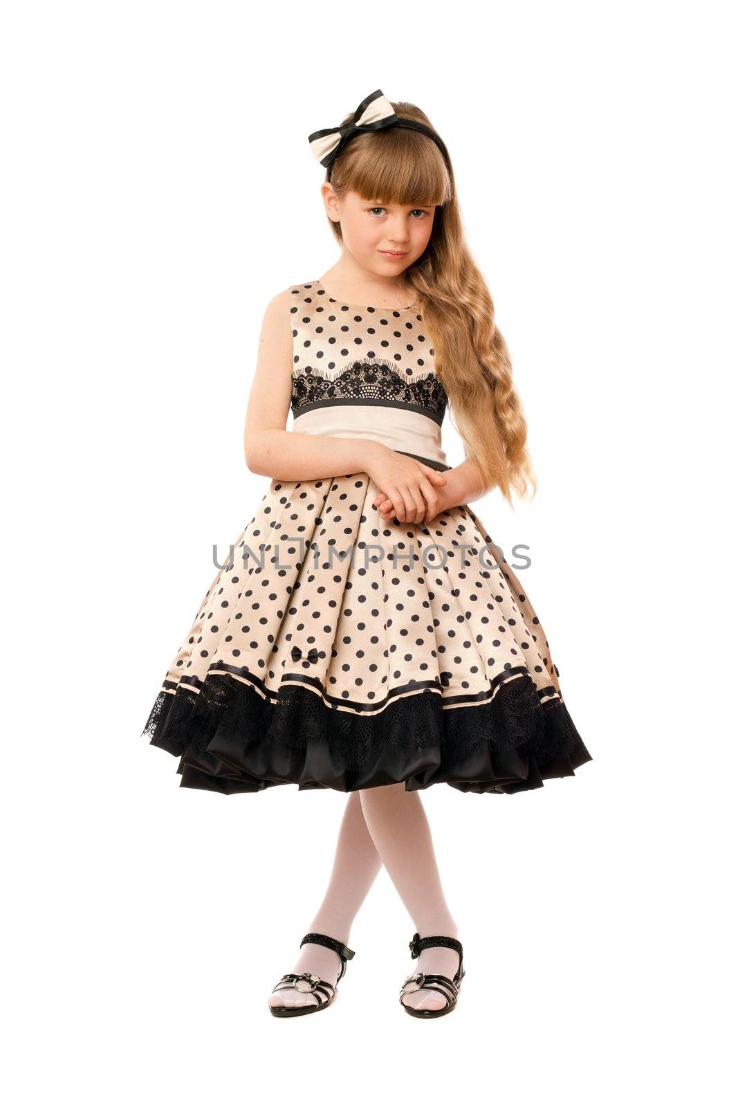 Nice little girl in a dress. Isolated