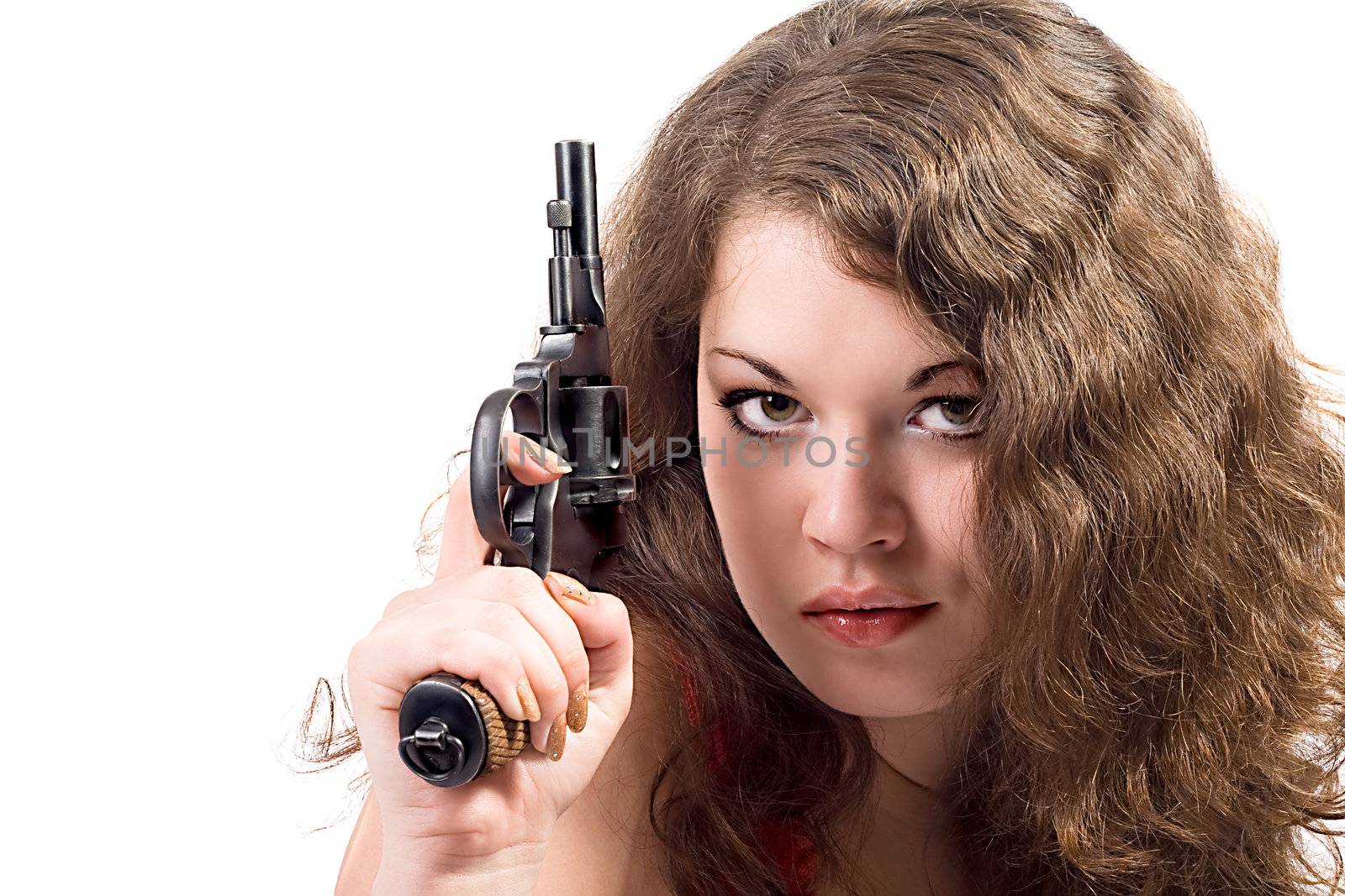 Young woman with a pistol. Isolated on white