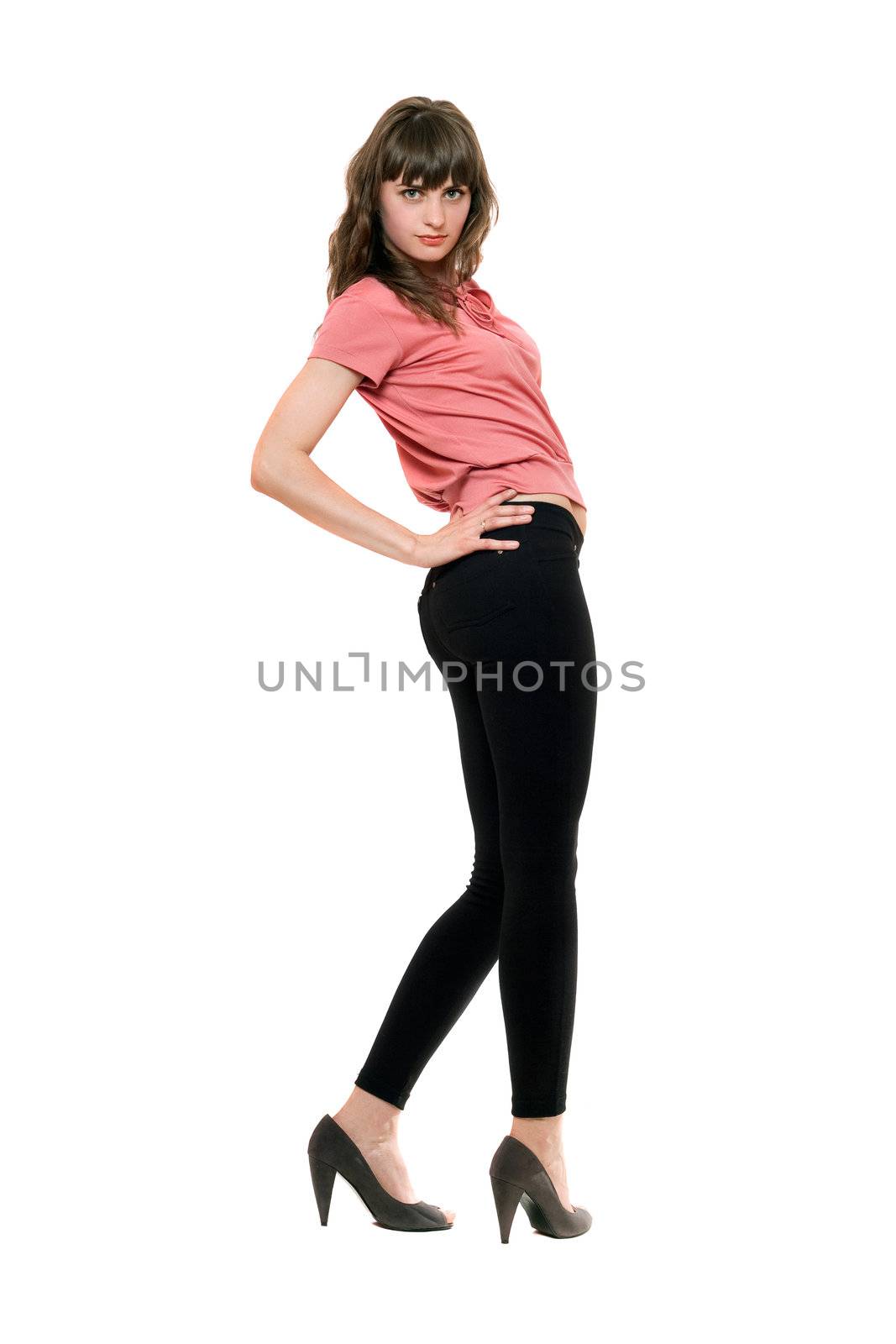 Young pretty woman in a black leggings. Isolated on white