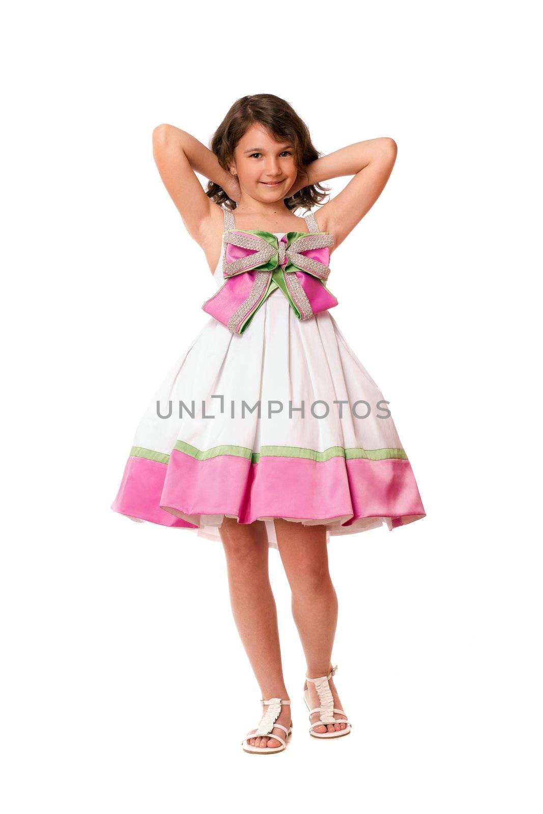 Attractive little girl in white and pink dress. Isolated