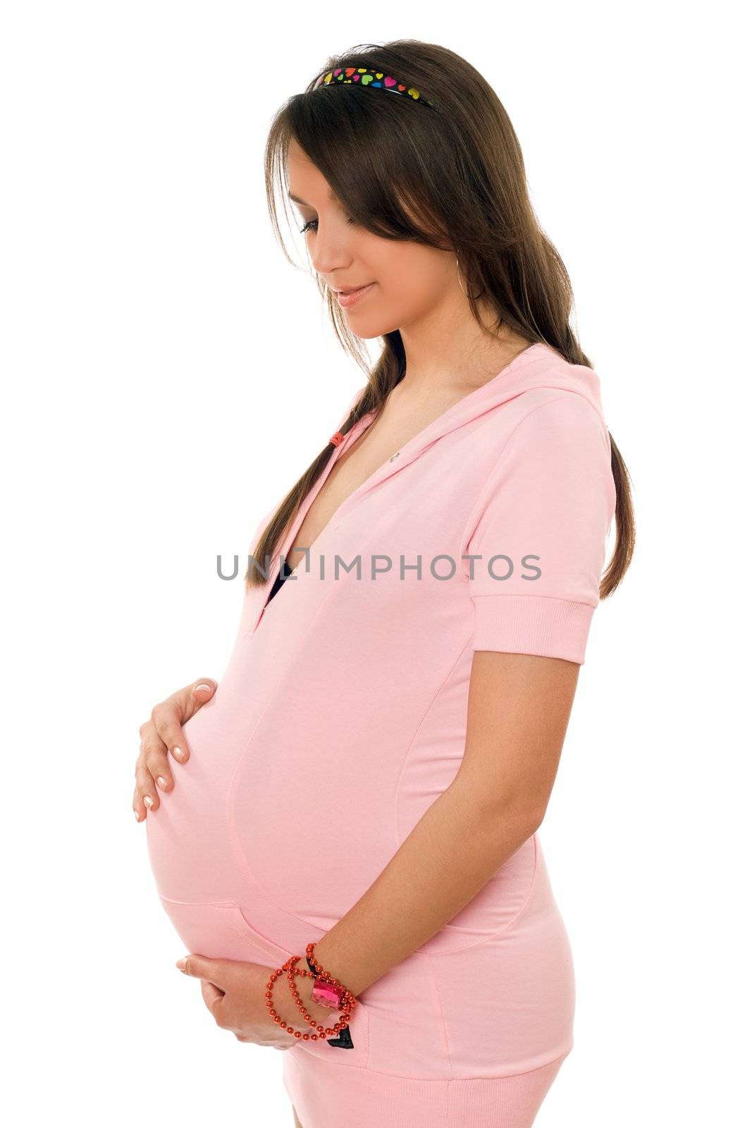 Beautiful young pregnant brunette lady. Isolated