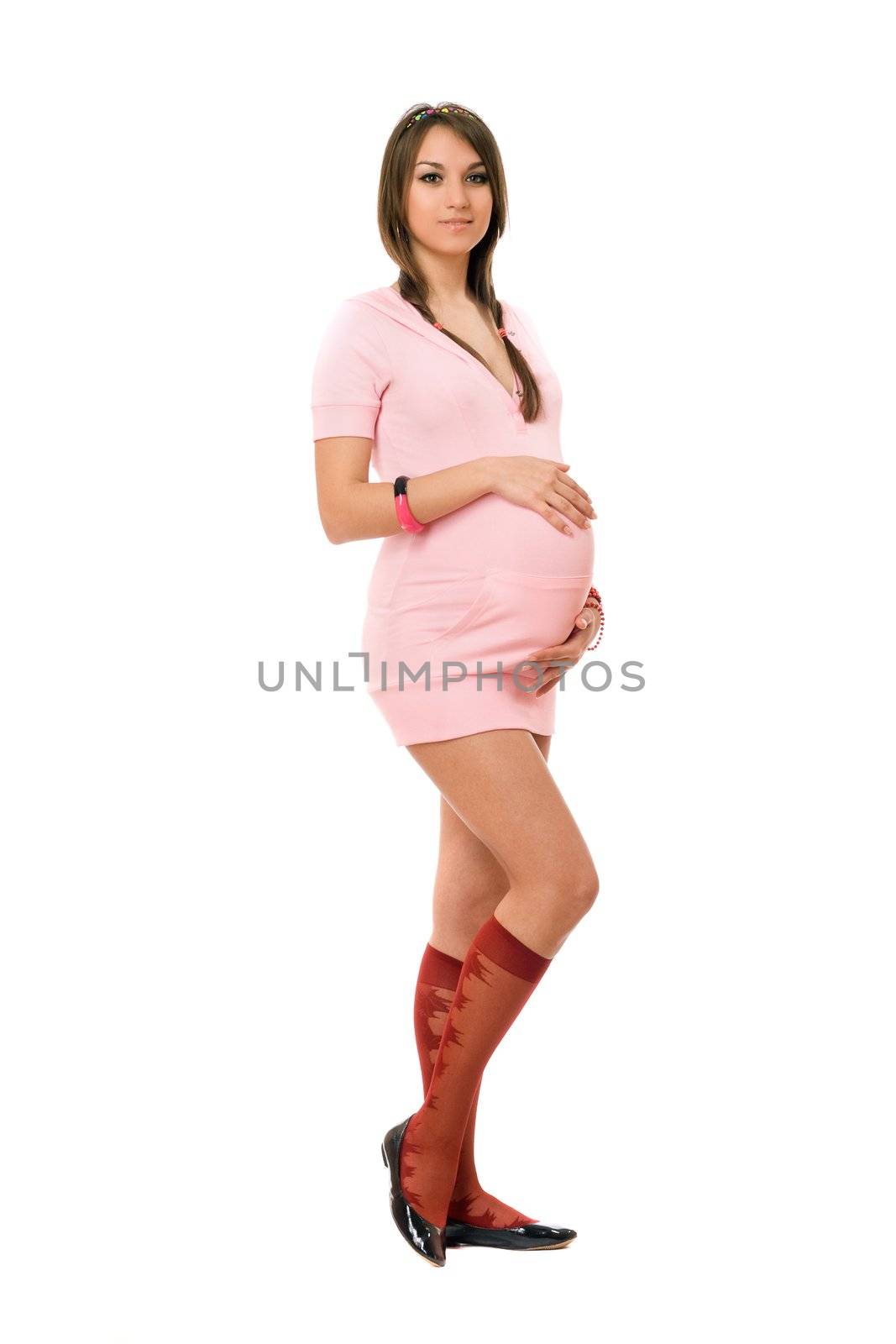 Charming young pregnant brunette lady. Isolated