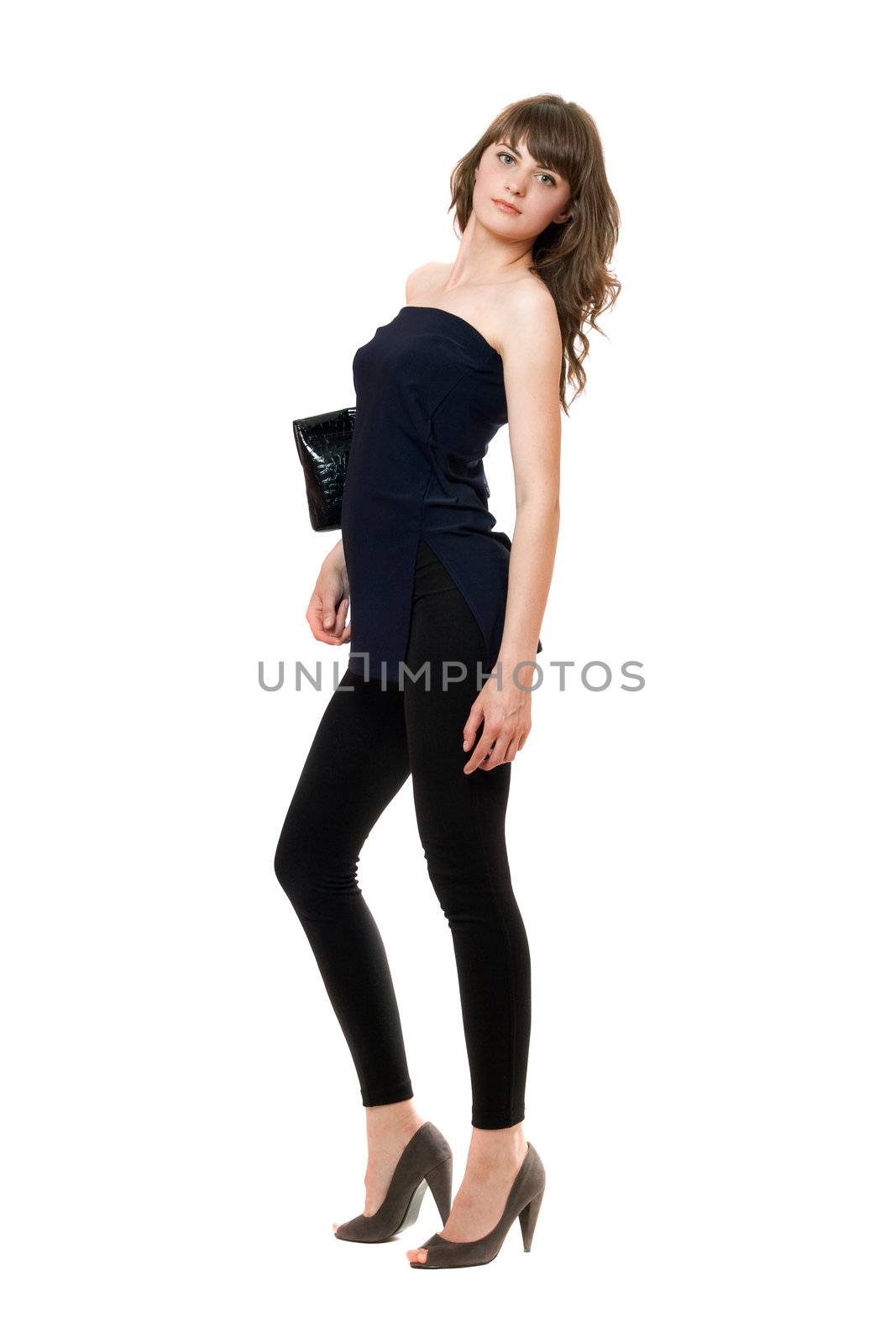 Pretty girl in a black leggings. Isolated on white