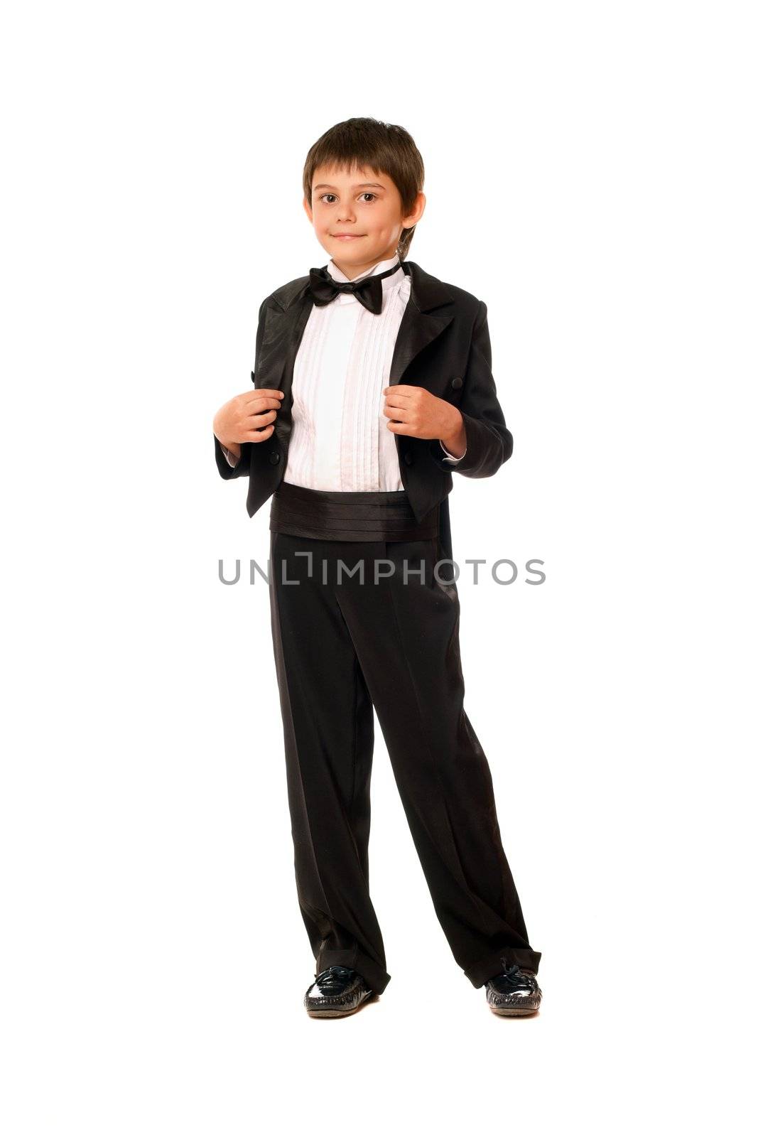 Handsome little boy in a tuxedo. Isolated