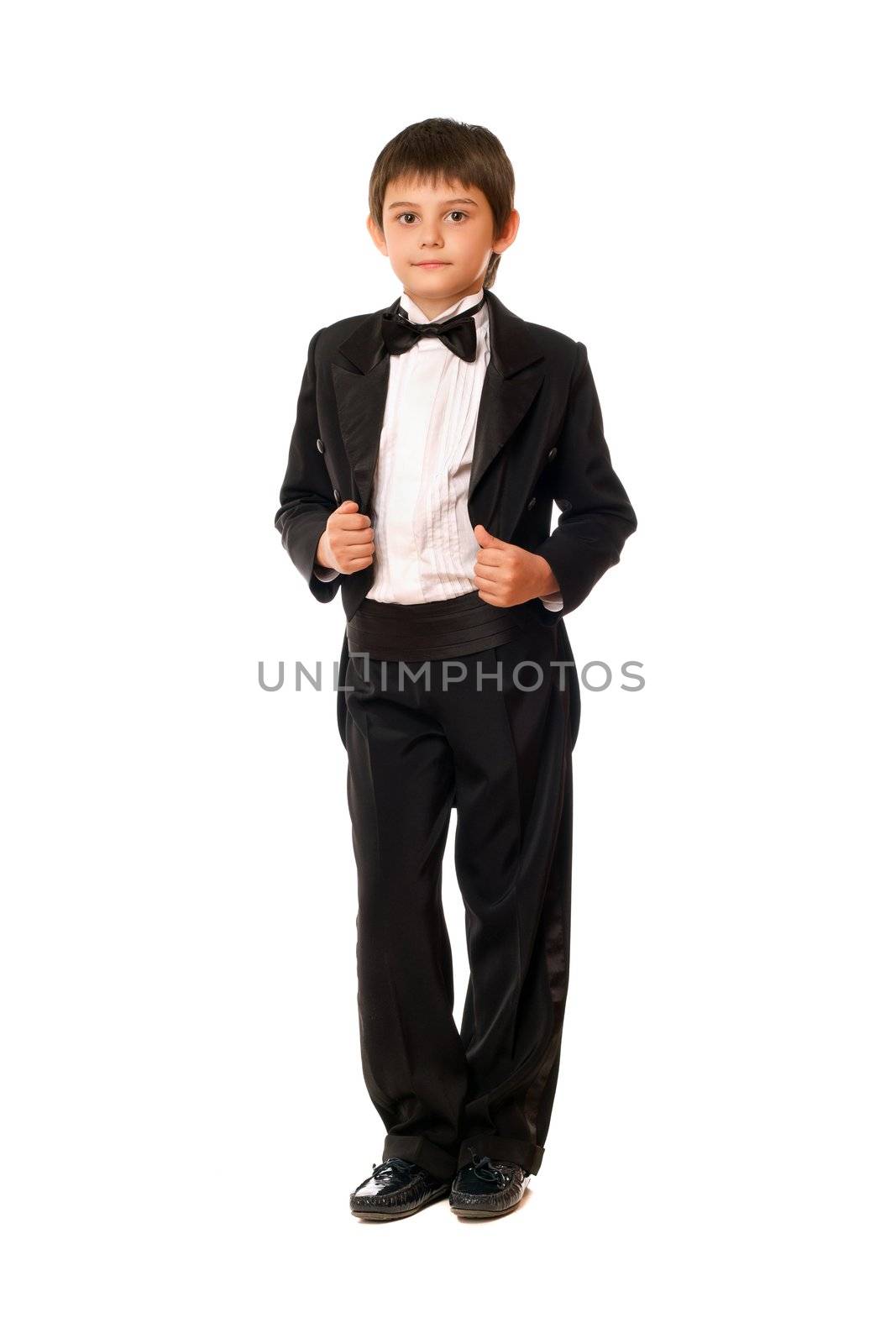 Handsome little boy in a tuxedo. Isolated on white