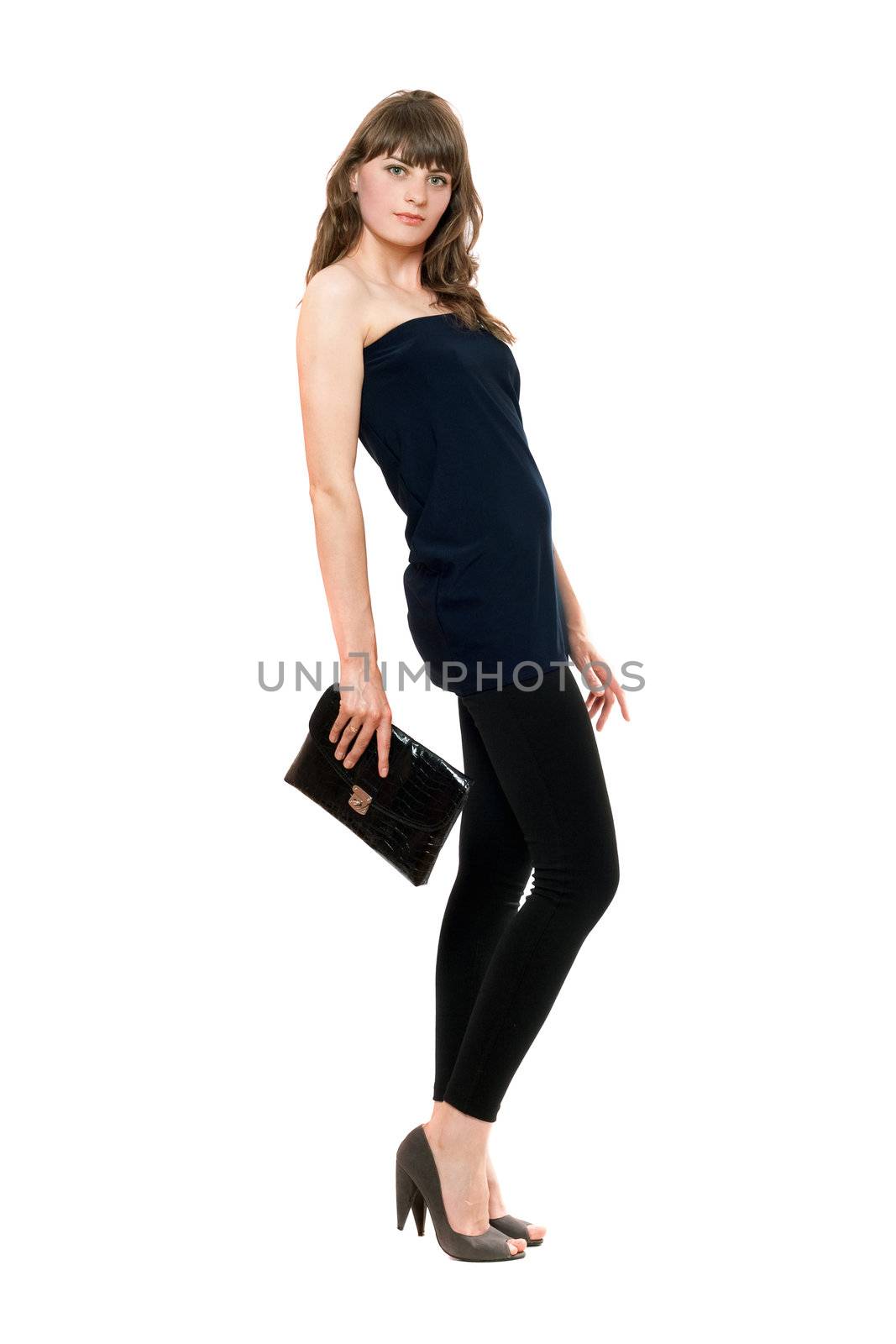 Lovely girl in black leggings with a handbag. Isolated