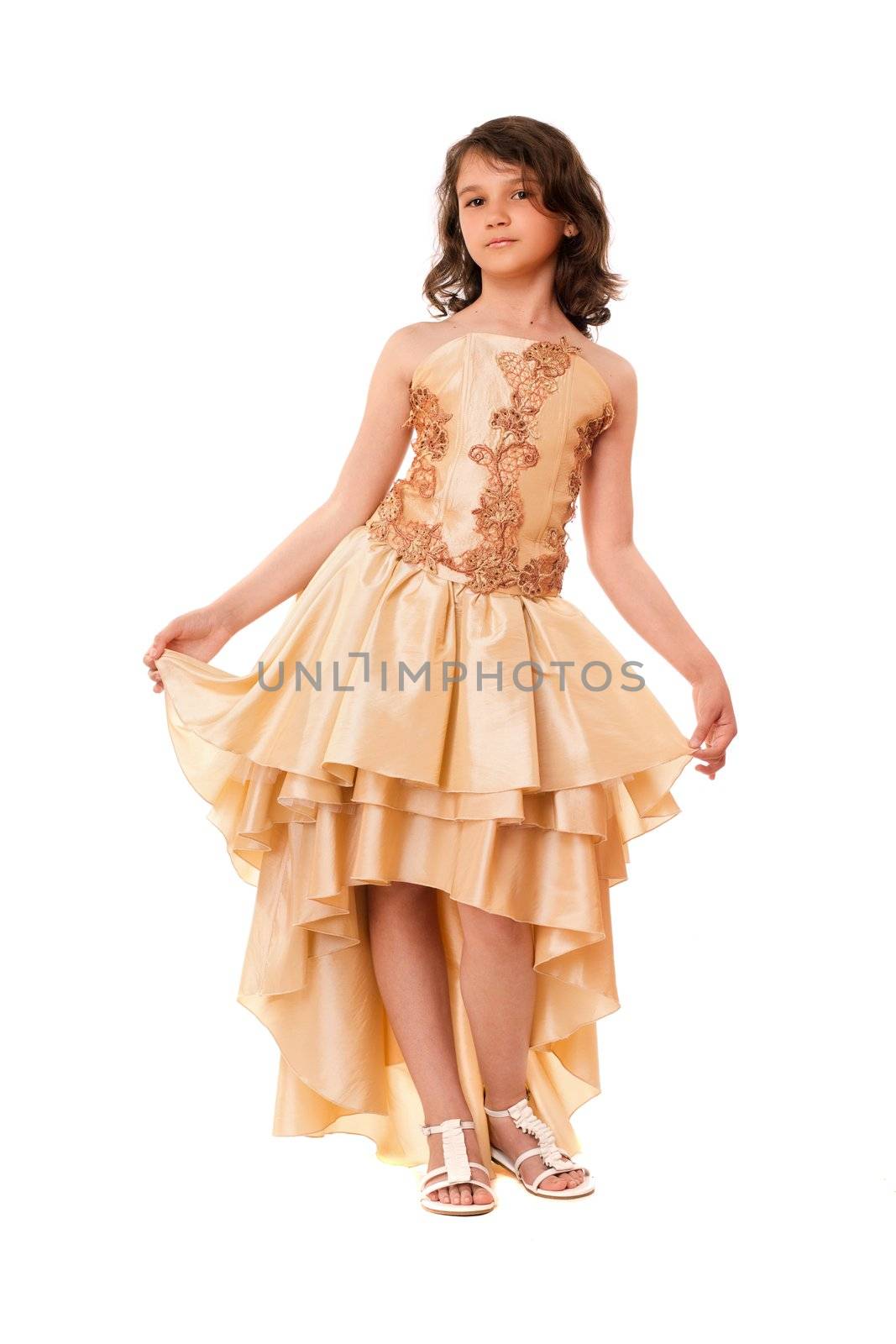 Cute little girl in a chic evening dress. Isolated