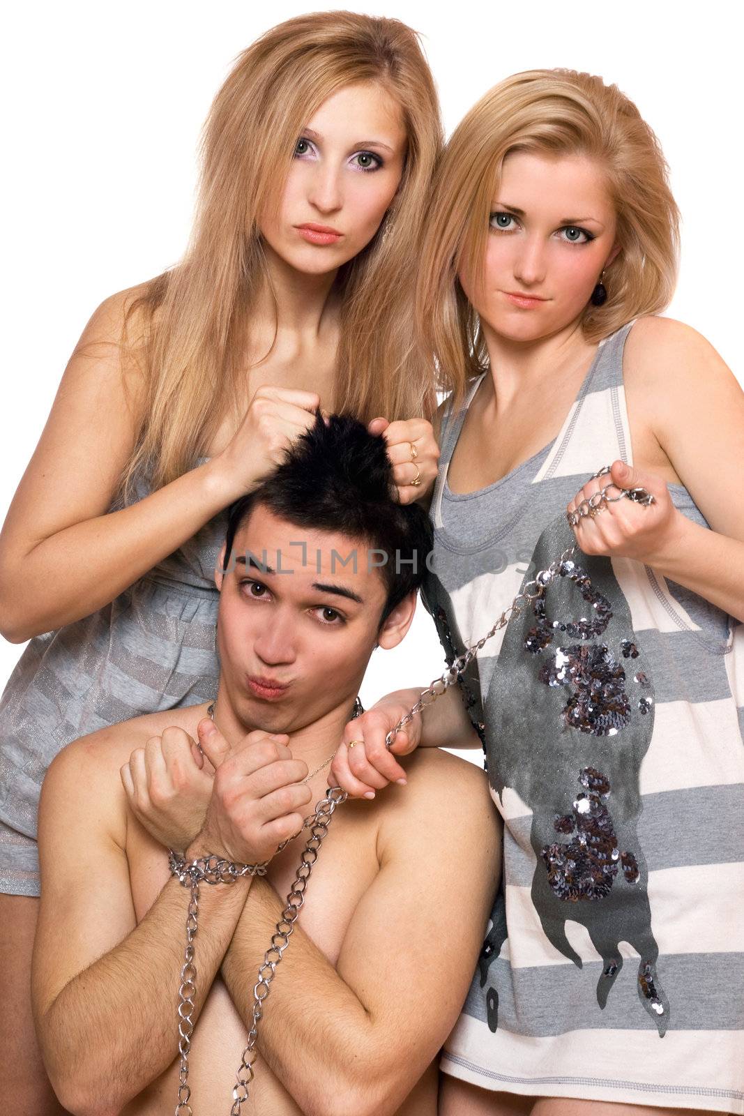 Two playful girls and a guy in chains. Isolated