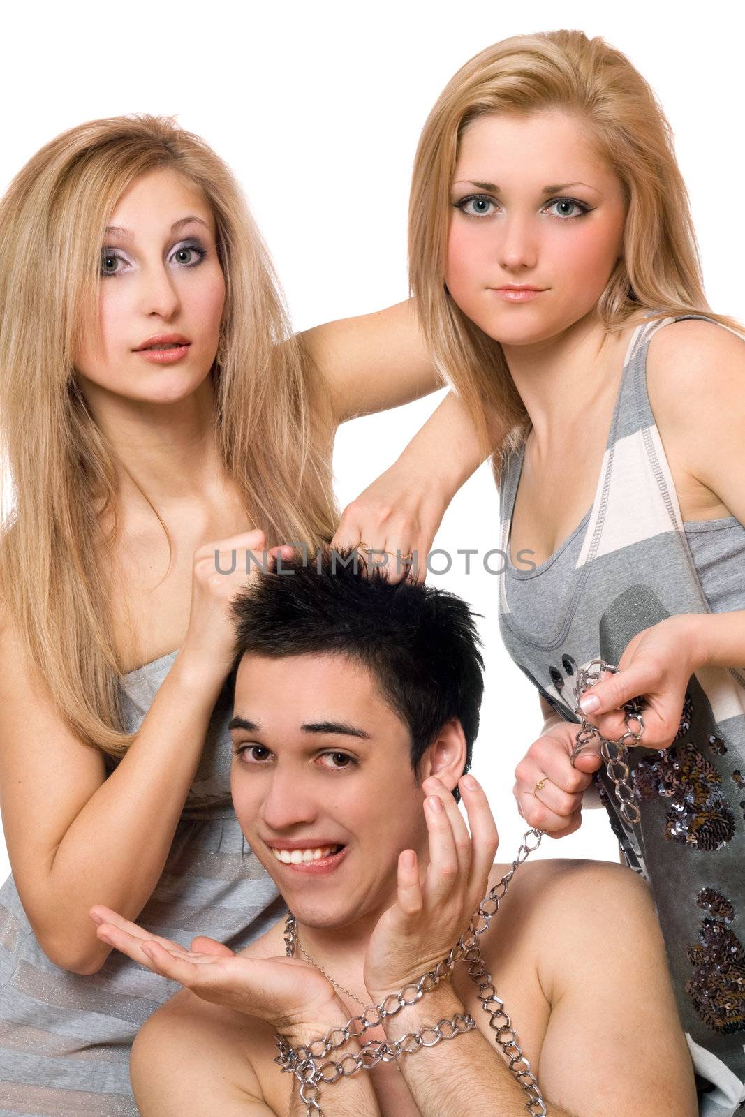 Two young blonde and a guy in chains. Isolated