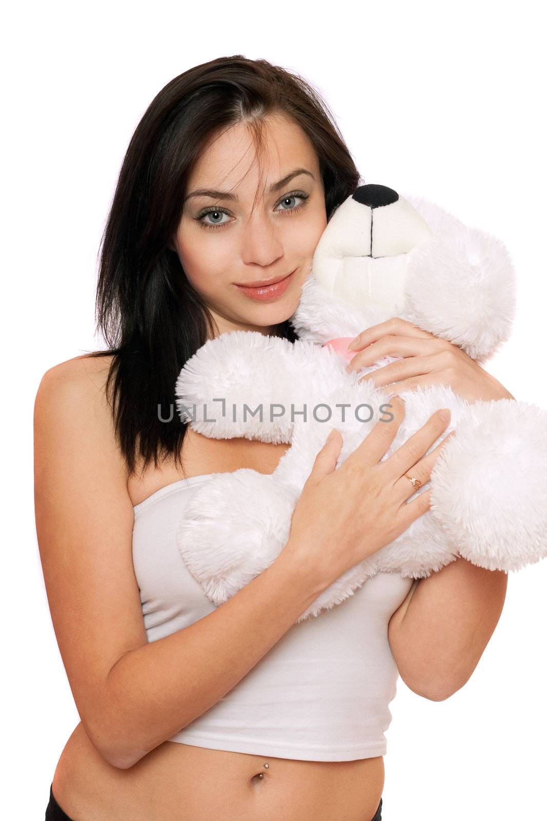 Smiling cute girl with a teddybear. Isolated